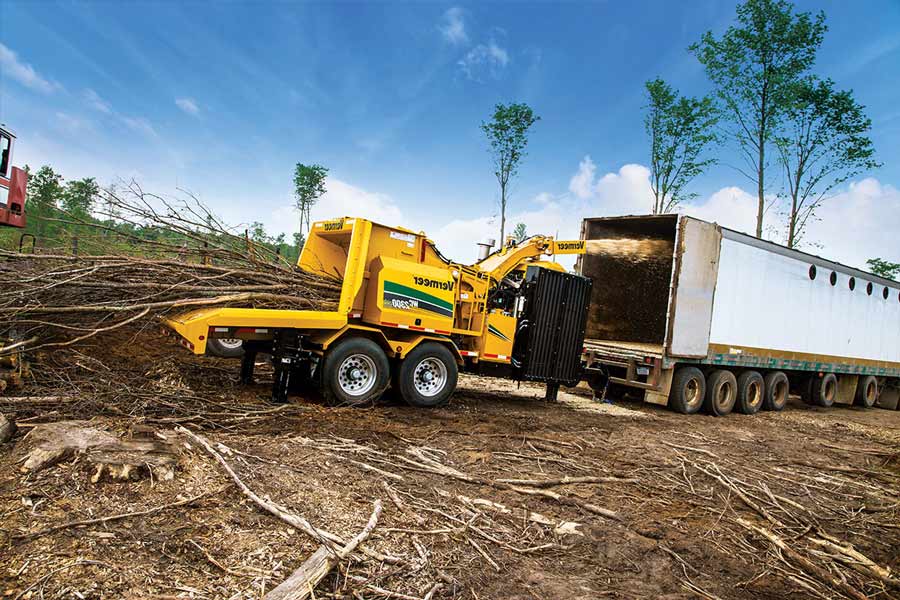 tub grinder chipping trees in land clearing operation