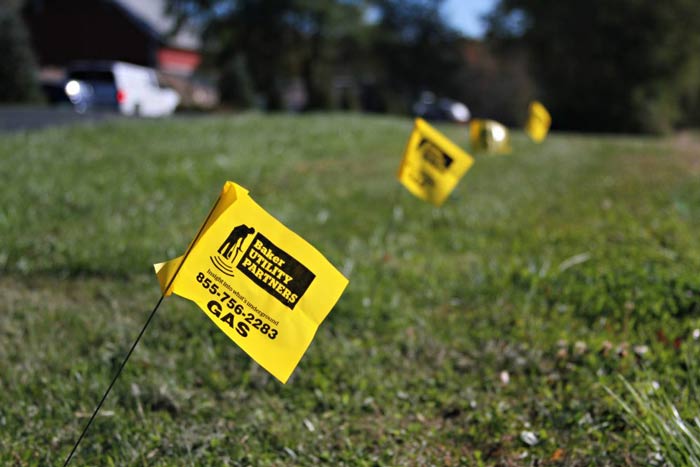 yellow flag marking underground utilities